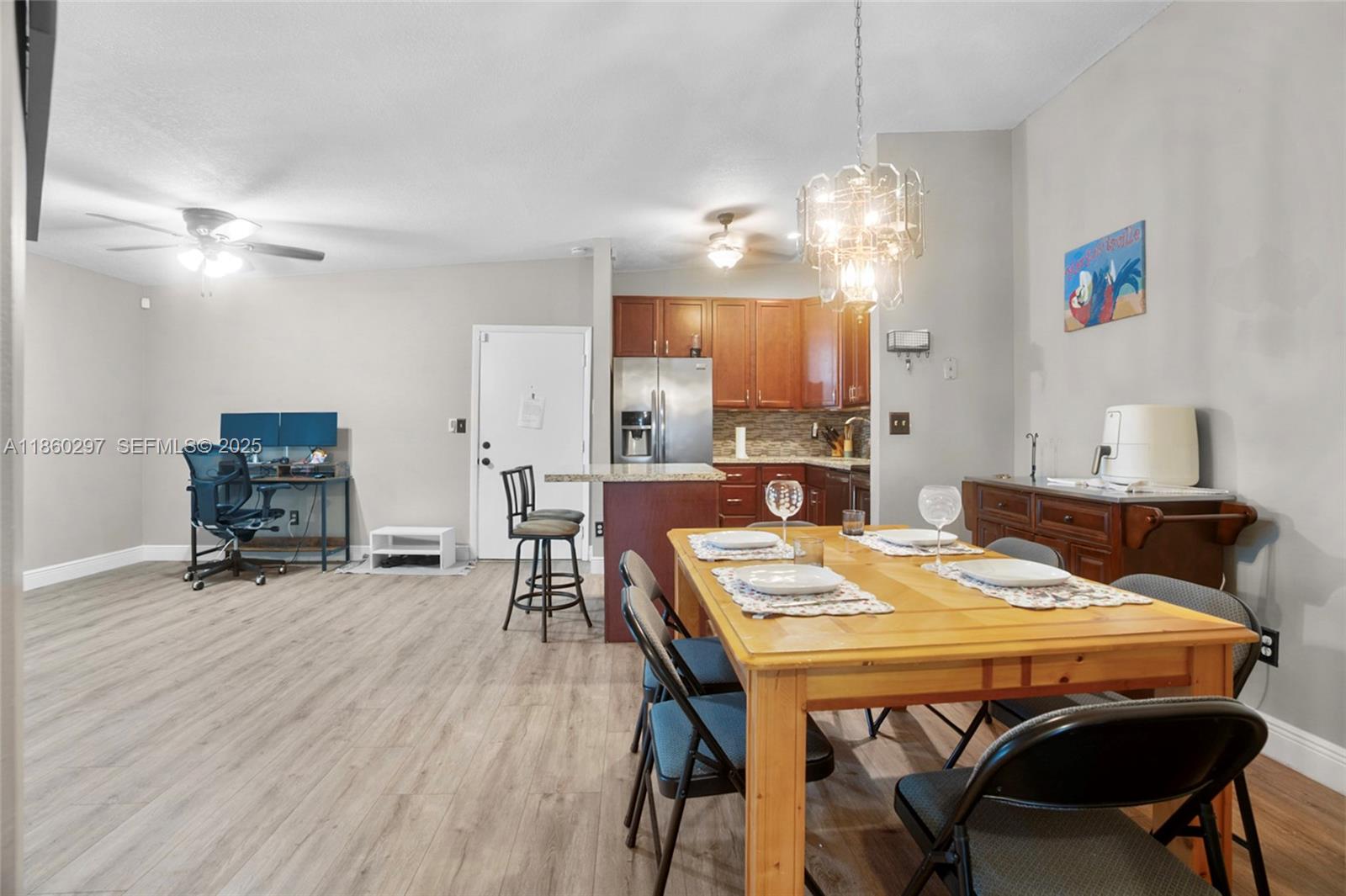 9606 West McNab Road, Unit 202 Tamarac, FL 33321 - Photo 5 of 29 a dining room with furniture and window