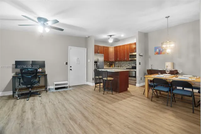 a view of a dining room with furniture and wooden floor