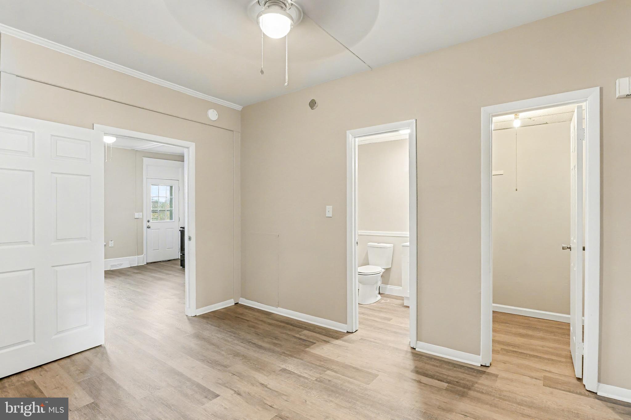 306 South Front Street, Unit A Wormleysburg, PA 17043 - Photo 5 of 6 an empty room with wooden floor and a window