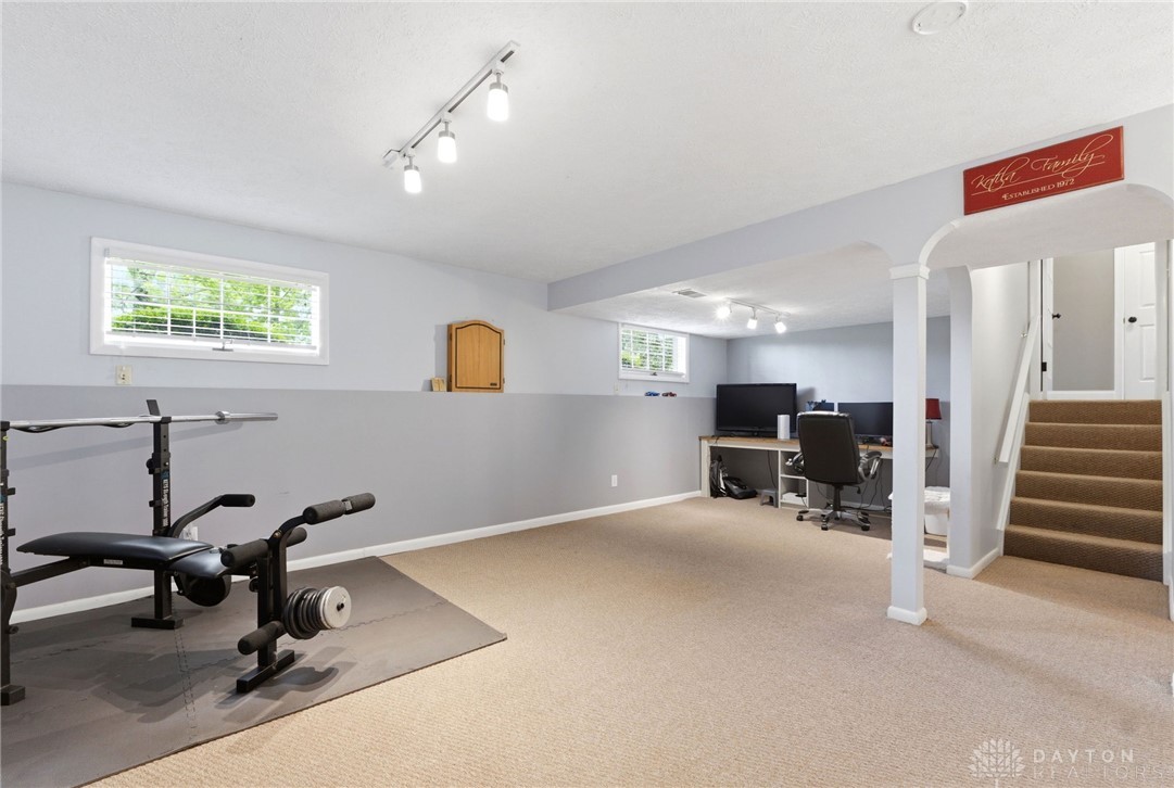 8916 Paragon Road Dayton, OH 45458 - Photo 23 of 33 This versatile basement space offers abundant potential for recreation or a home office setup.