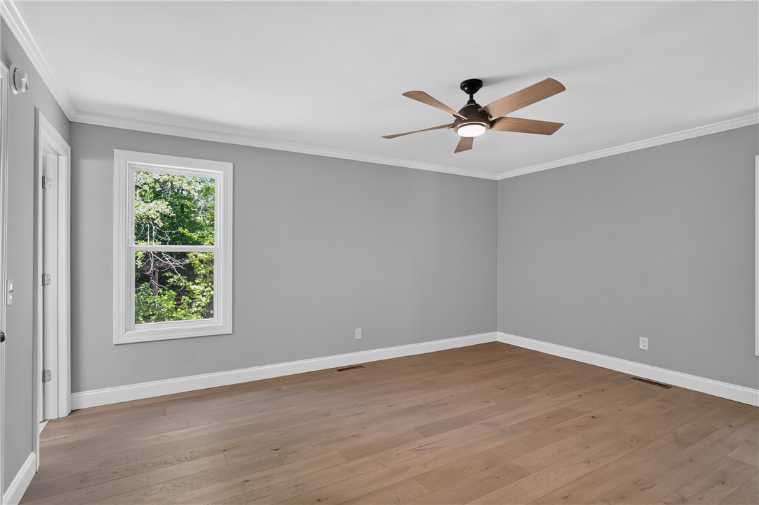 712 Beech Drive Seneca, SC 29678 - Photo 19 of 41 Hardwood floors and a nature-framed window illuminate this versatile room.
