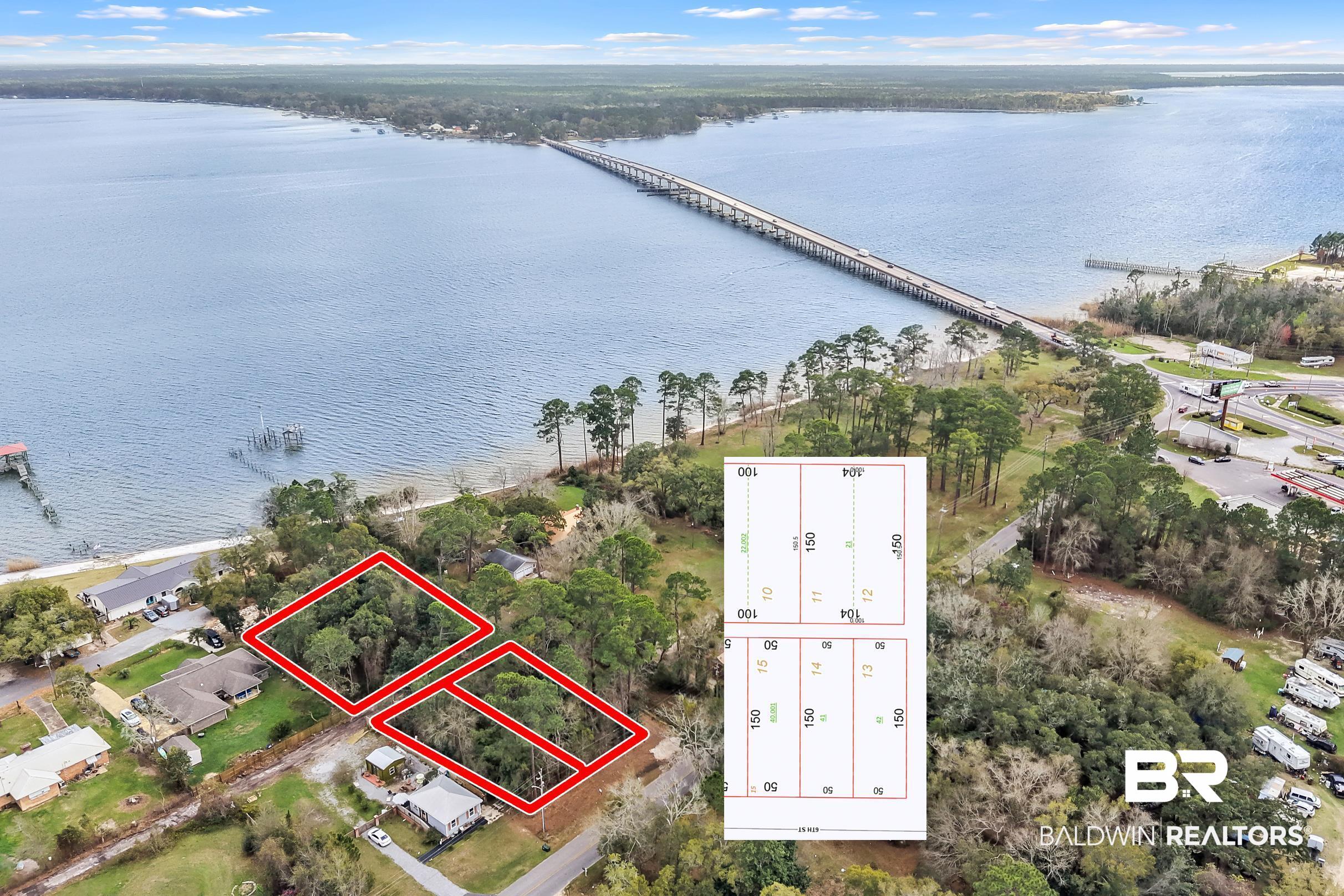 0 5th Street Lillian, AL 36549 - Photo 1 of 5 Aerial view of property and surrounding area featuring property parcel outlined, a nearby body of water, and a notable bridge