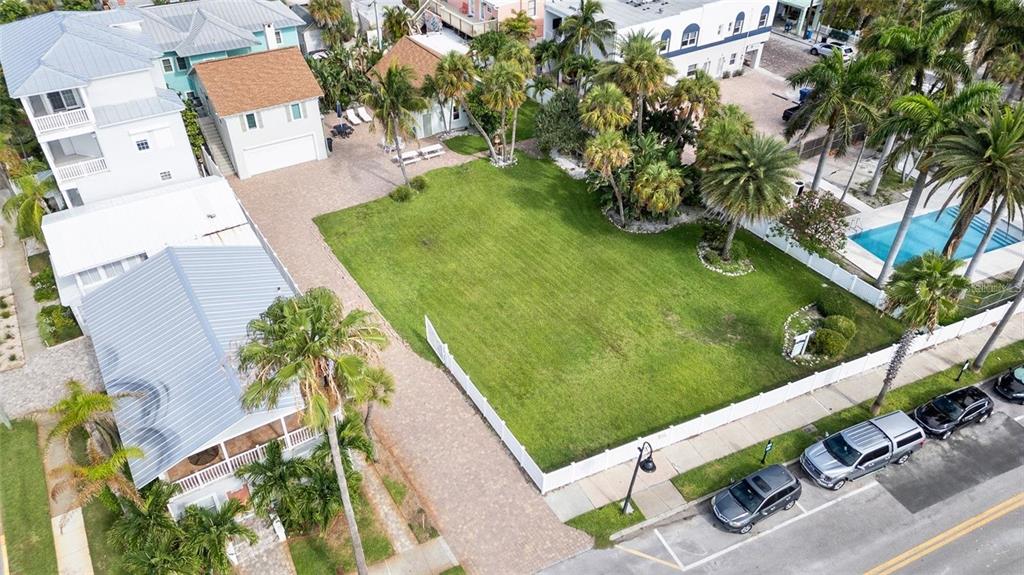 702 Pass A Grille Way St. Pete Beach, FL 33706 - Photo 5 of 41 an aerial view of a house with garden space and trees