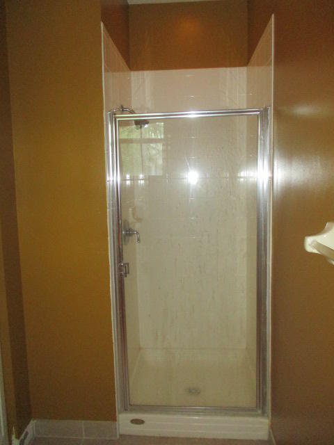 1140 Northwest 18th Avenue Boca Raton, FL 33431 - Photo 13 of 18 a bathroom with a glass door