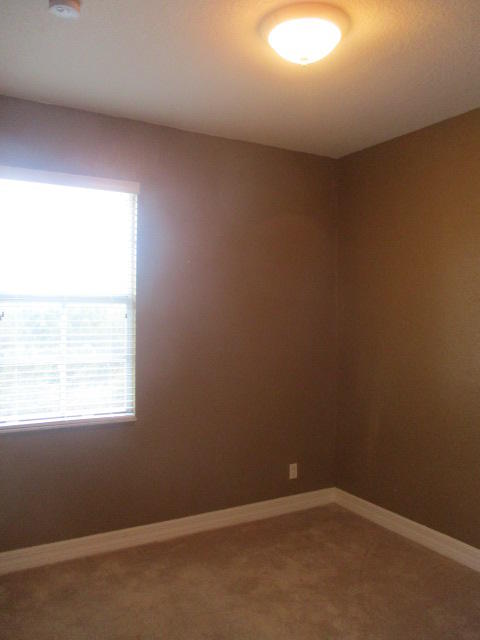 1140 Northwest 18th Avenue Boca Raton, FL 33431 - Photo 14 of 18 an empty room with a window