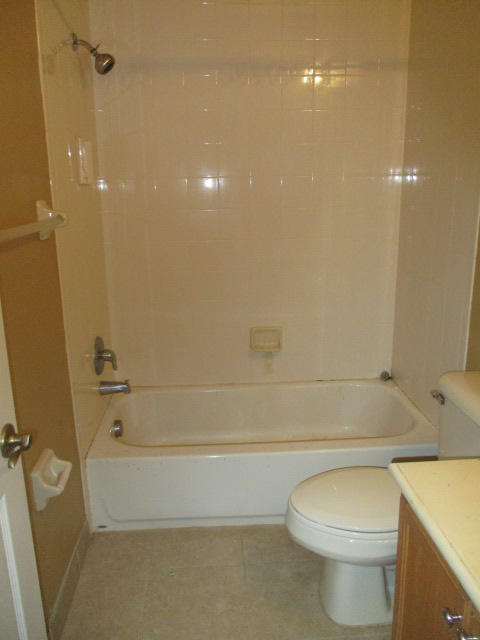 1140 Northwest 18th Avenue Boca Raton, FL 33431 - Photo 18 of 18 a bathroom with a toilet and a bathtub