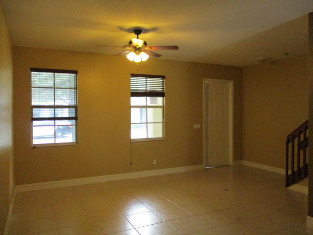 1140 Northwest 18th Avenue Boca Raton, FL 33431 - Photo 4 of 18 a view of an empty room with a chandelier fan
