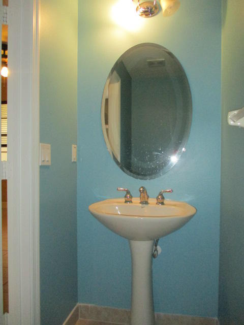 1140 Northwest 18th Avenue Boca Raton, FL 33431 - Photo 7 of 18 a bathroom with a sink and a mirror