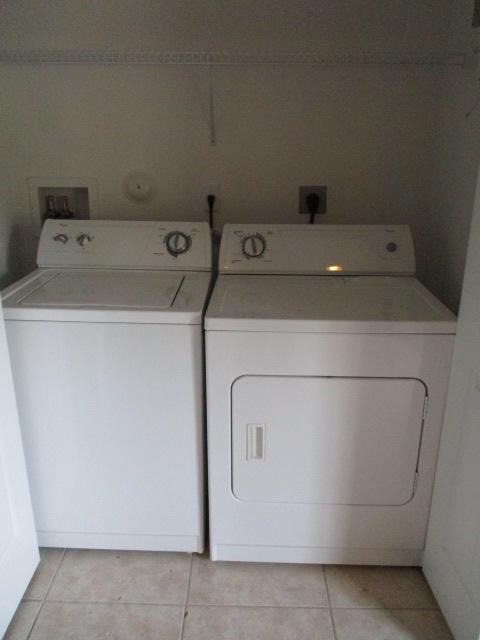 1140 Northwest 18th Avenue Boca Raton, FL 33431 - Photo 8 of 18 a utility room with dryer and washer