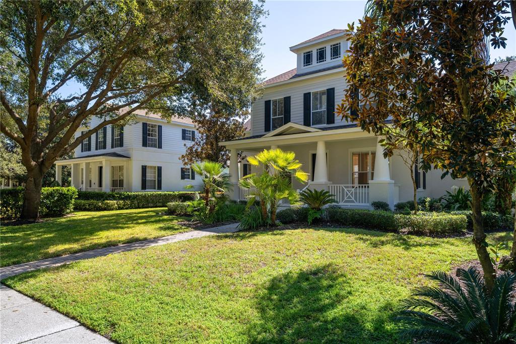 11905 Camden Park Drive Windermere, FL 34786 - Photo 3 of 32 a front view of a house with garden