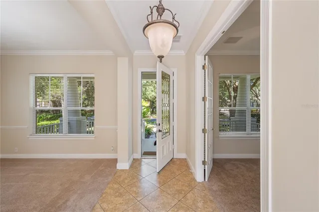 a view of a room with wooden floor and windows