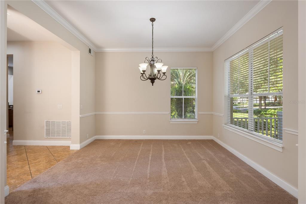 11905 Camden Park Drive Windermere, FL 34786 - Photo 6 of 32 a view of a room with windows and a chandelier
