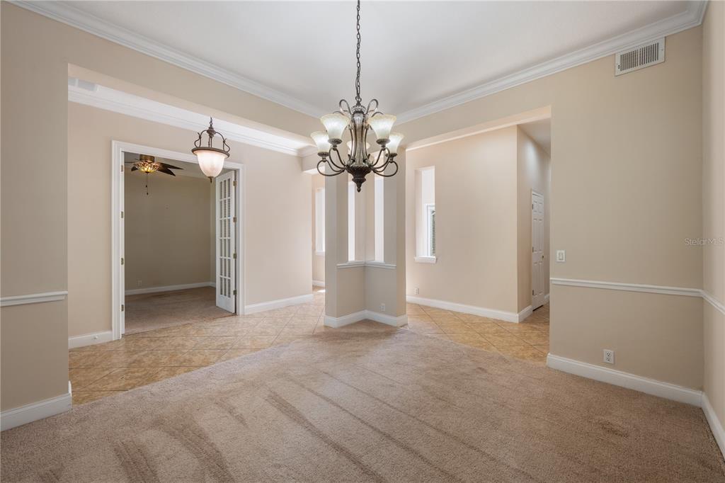 11905 Camden Park Drive Windermere, FL 34786 - Photo 7 of 32 a view of a chandelier in big room and a bathroom