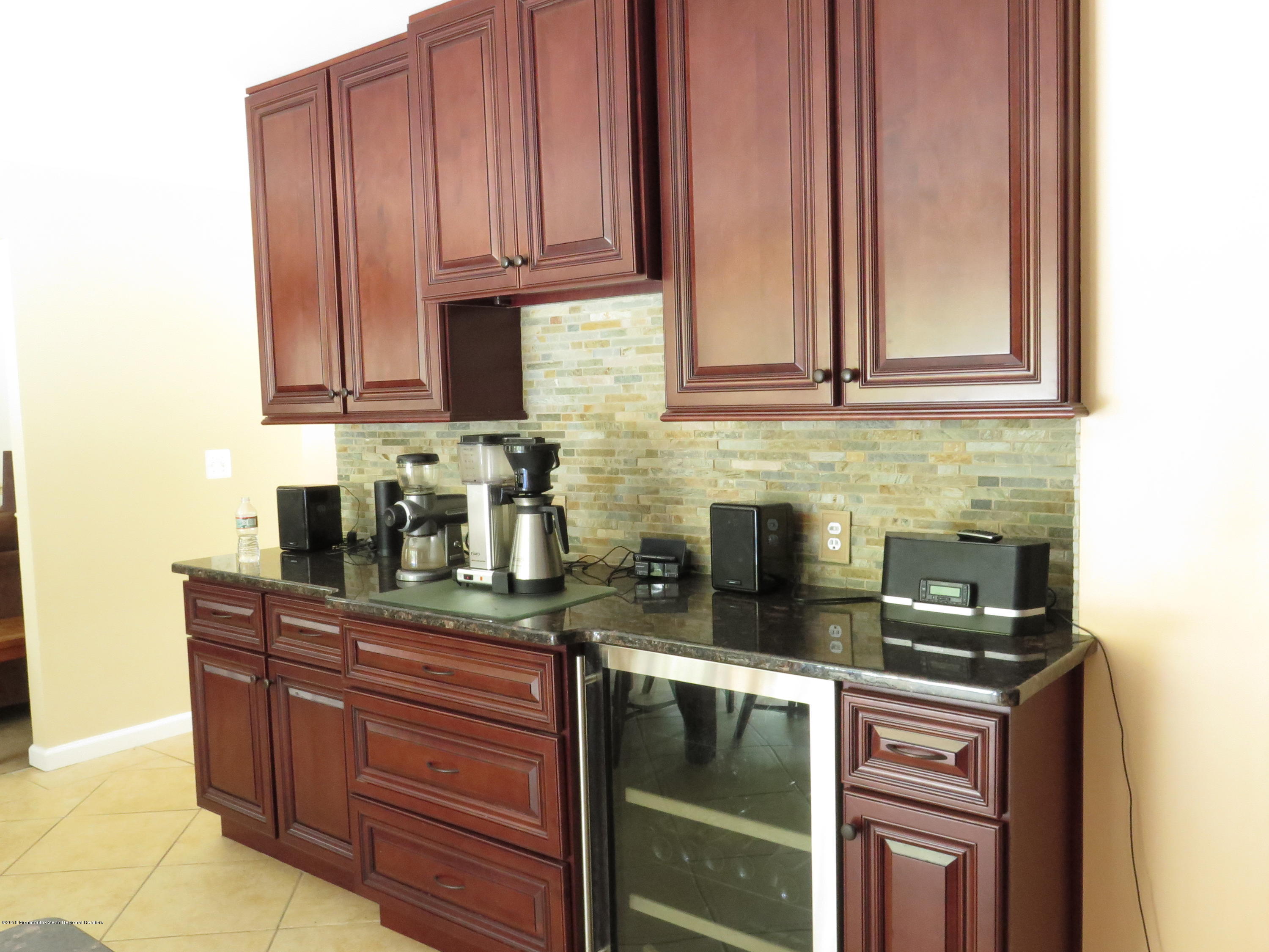 59 Chelsea Road Jackson, NJ 08527 - Photo 9 of 42 a kitchen with granite countertop cabinets and window