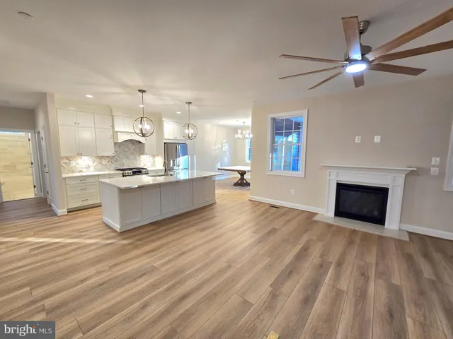 a view of kitchen with cabinets and wooden floor