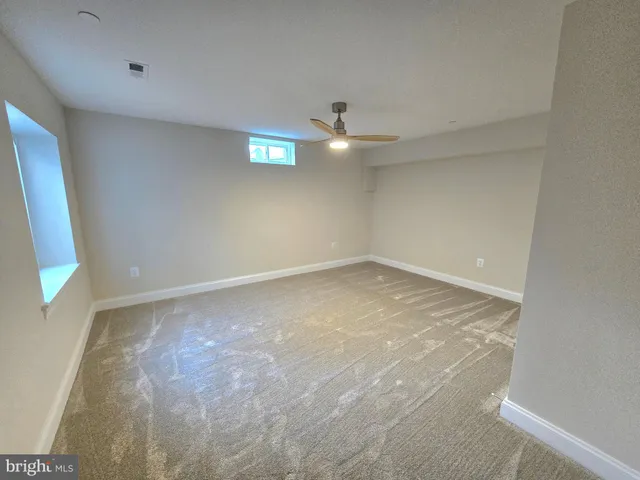 a kitchen with stainless steel appliances a refrigerator sink and microwave