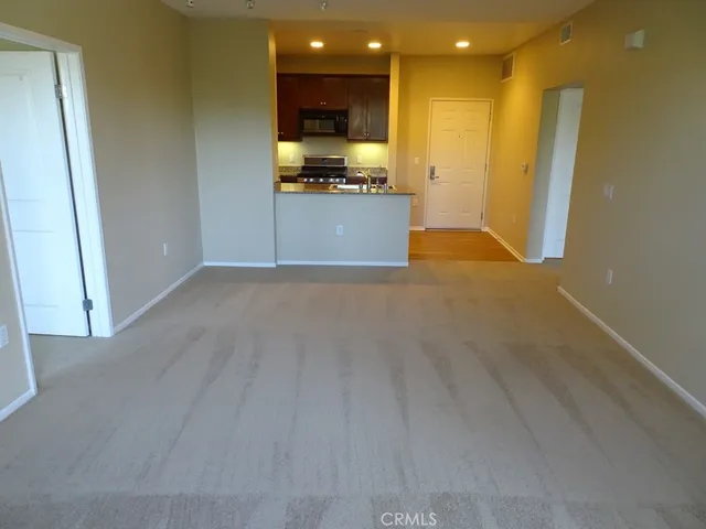 a kitchen with granite countertop a stove and a microwave