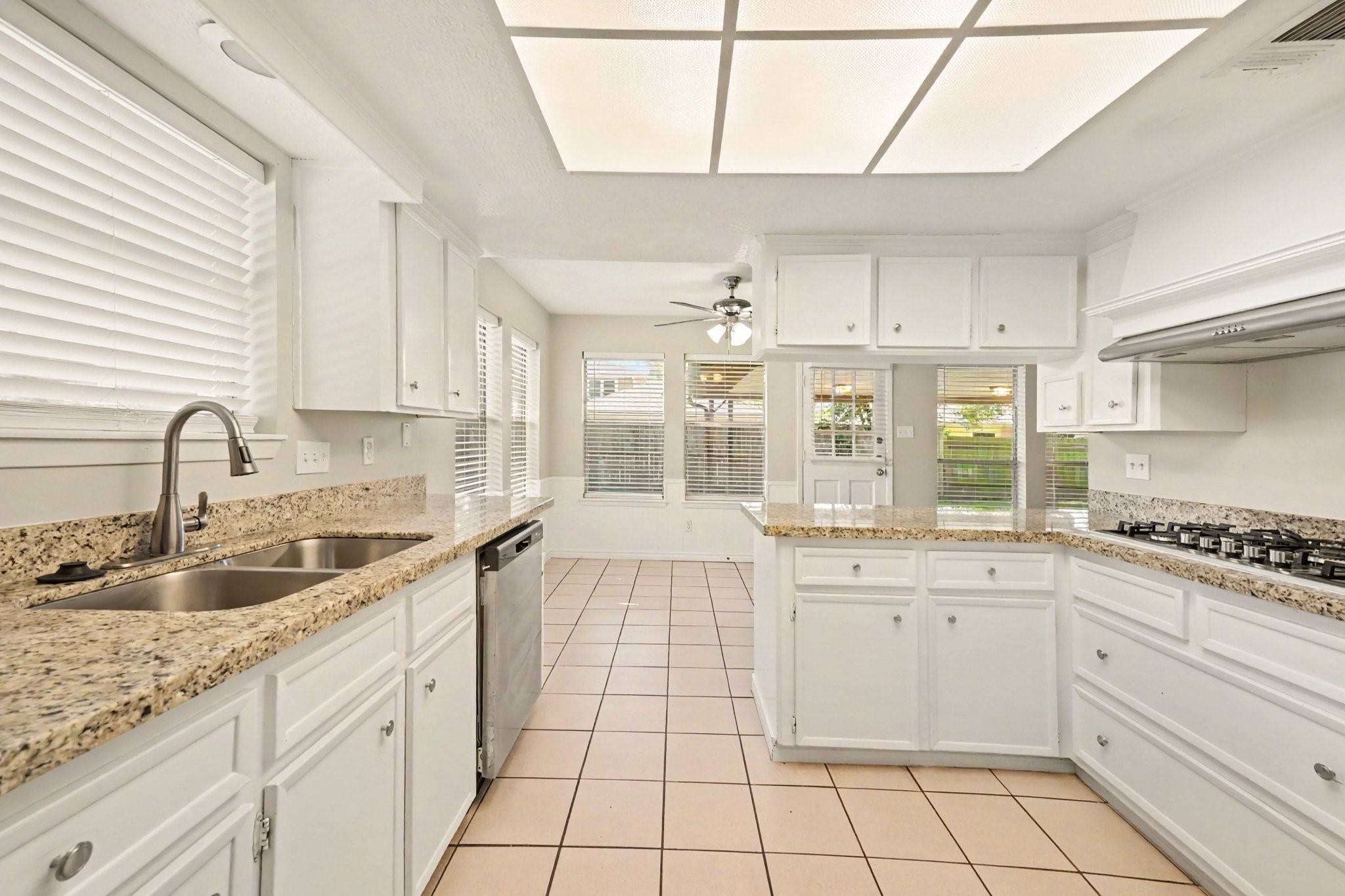 17419 Cassina Drive Spring, TX 77388 - Photo 16 of 35 a kitchen with a sink stove and cabinets