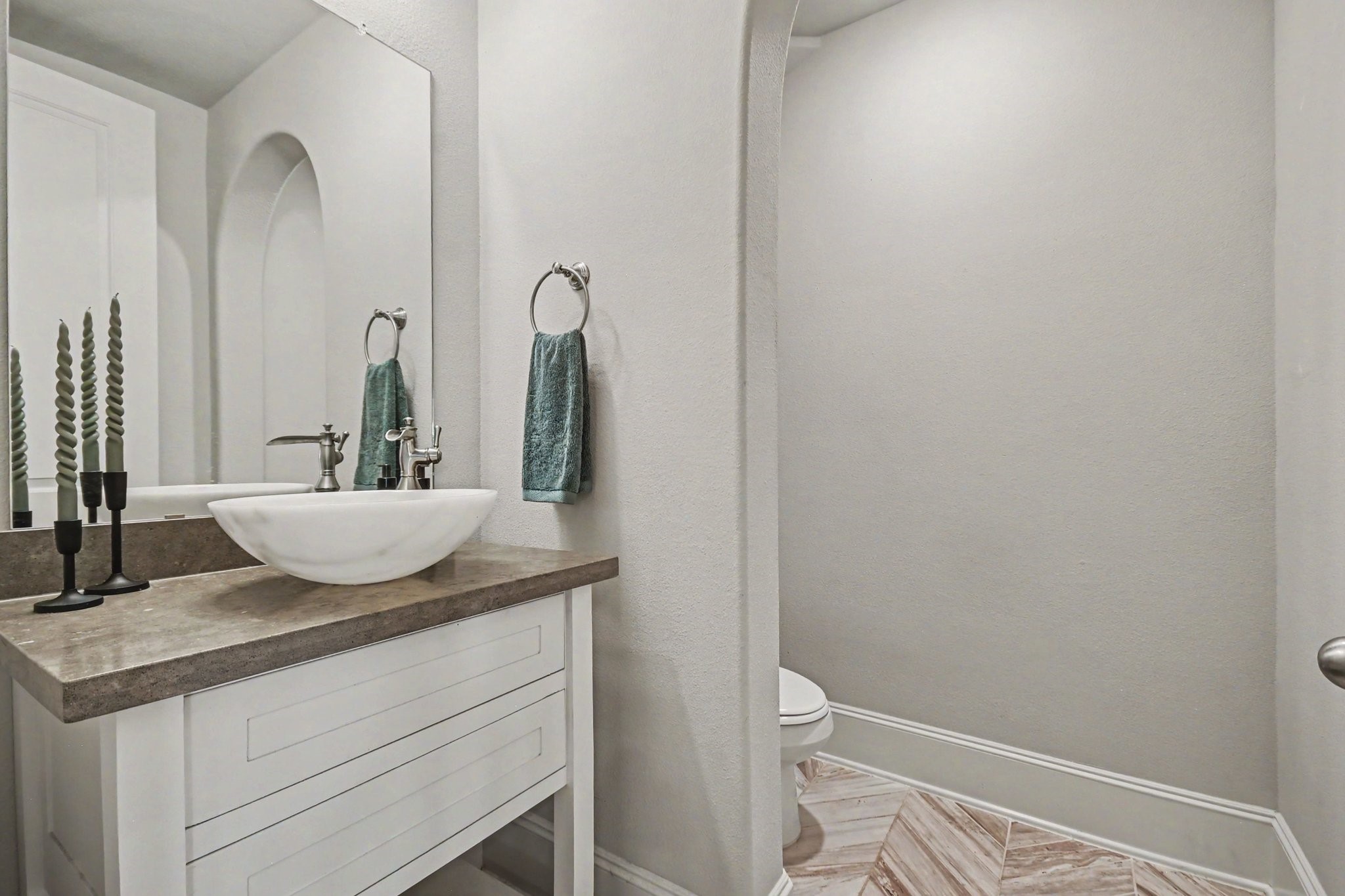641 Kickapoo Court Webster, TX 77598 - Photo 16 of 39 Here is your modern, stylish bathroom with a vessel sink on a sleek countertop and elegant fixtures. The space is well-lit and has a clean, minimalist design.