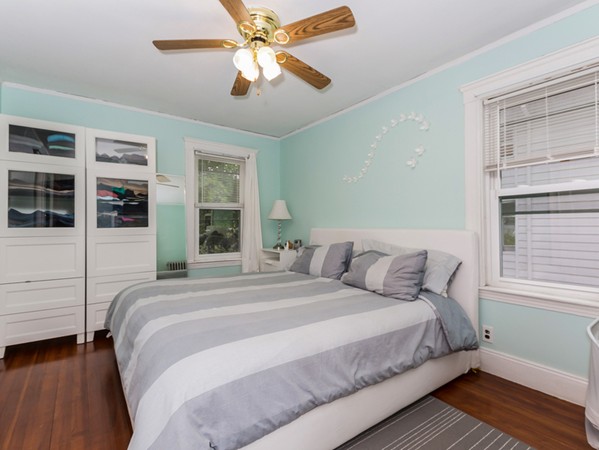 348 Lagrange Street Boston, MA 02132 - Photo 11 of 25 a bedroom with a large bed and a window