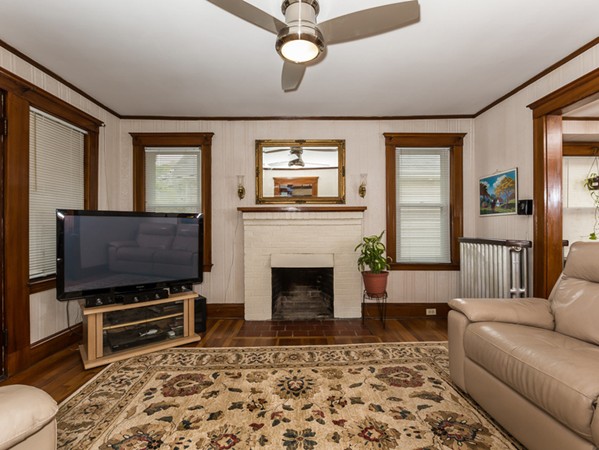 348 Lagrange Street Boston, MA 02132 - Photo 15 of 25 a living room with furniture and a flat screen tv