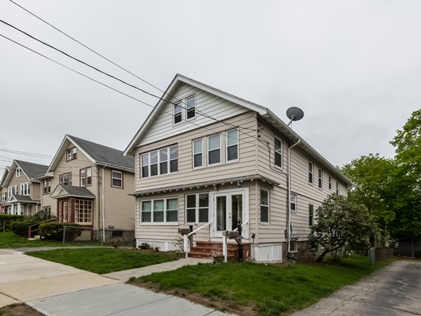 348 Lagrange Street Boston, MA 02132 - Photo 2 of 25 a front view of a house with a yard