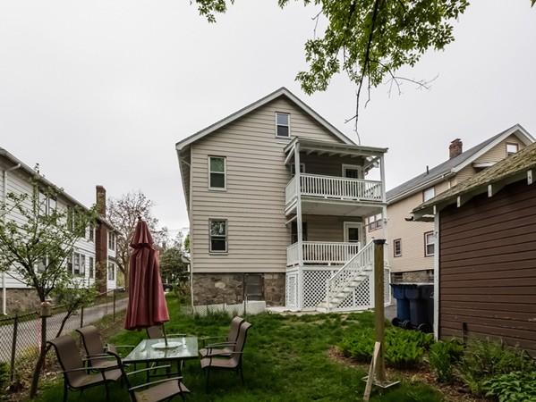348 Lagrange Street Boston, MA 02132 - Photo 24 of 25 a front view of house with yard and green space