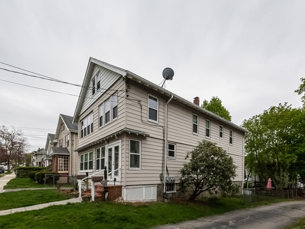 348 Lagrange Street Boston, MA 02132 - Photo 3 of 25 a front view of a house with a yard