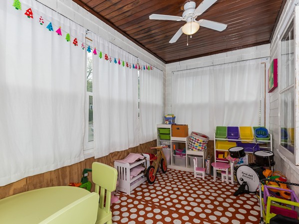 348 Lagrange Street Boston, MA 02132 - Photo 10 of 25 a room with furniture toys and a baby crib