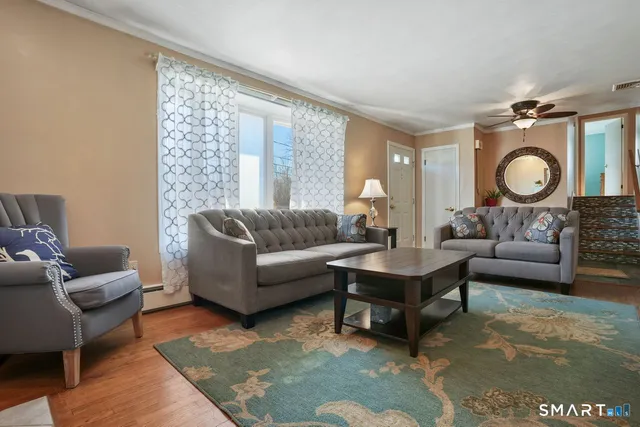 a living room with furniture and a large window