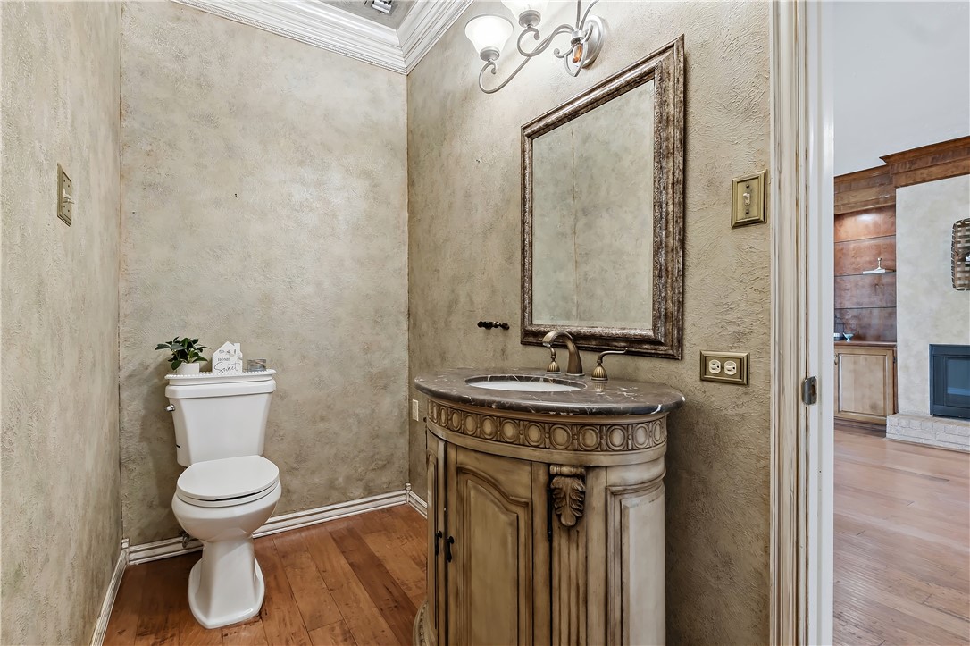 904 Bob White Street Bryan, TX 77802 - Photo 11 of 36 a bathroom with a toilet sink and mirror