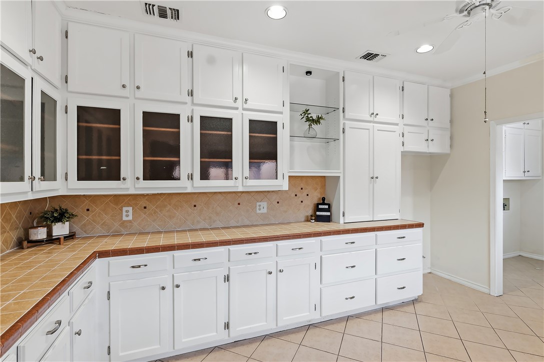 904 Bob White Street Bryan, TX 77802 - Photo 12 of 36 a kitchen with cabinets appliances and a sink