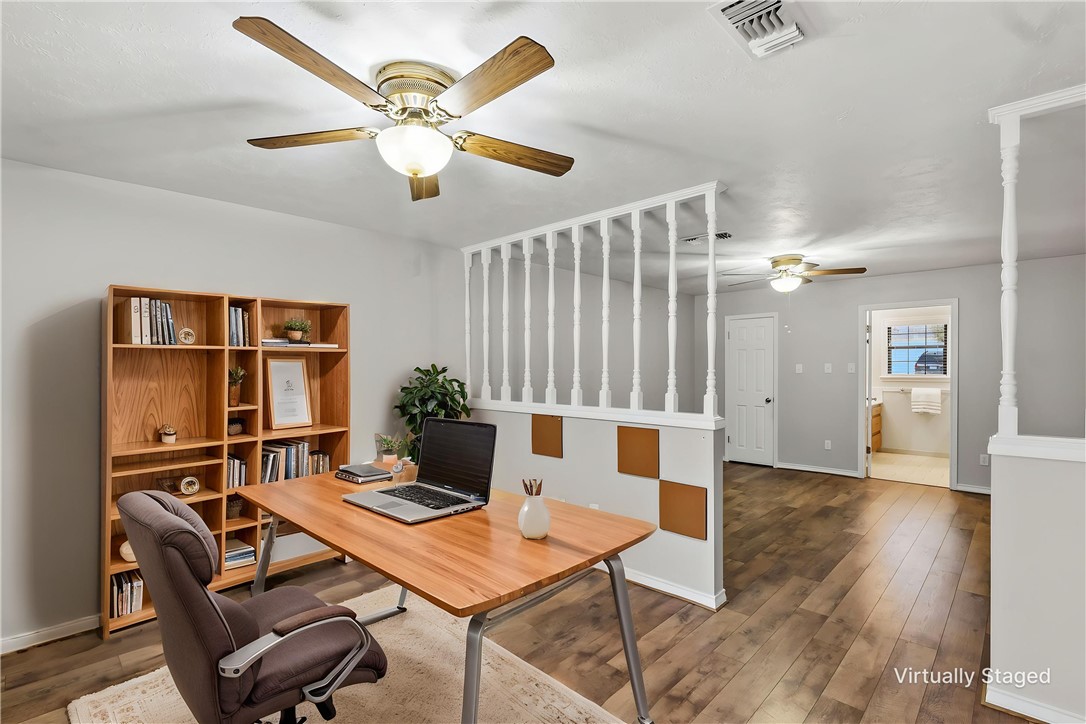 904 Bob White Street Bryan, TX 77802 - Photo 19 of 36 a workspace with furniture and wooden floor