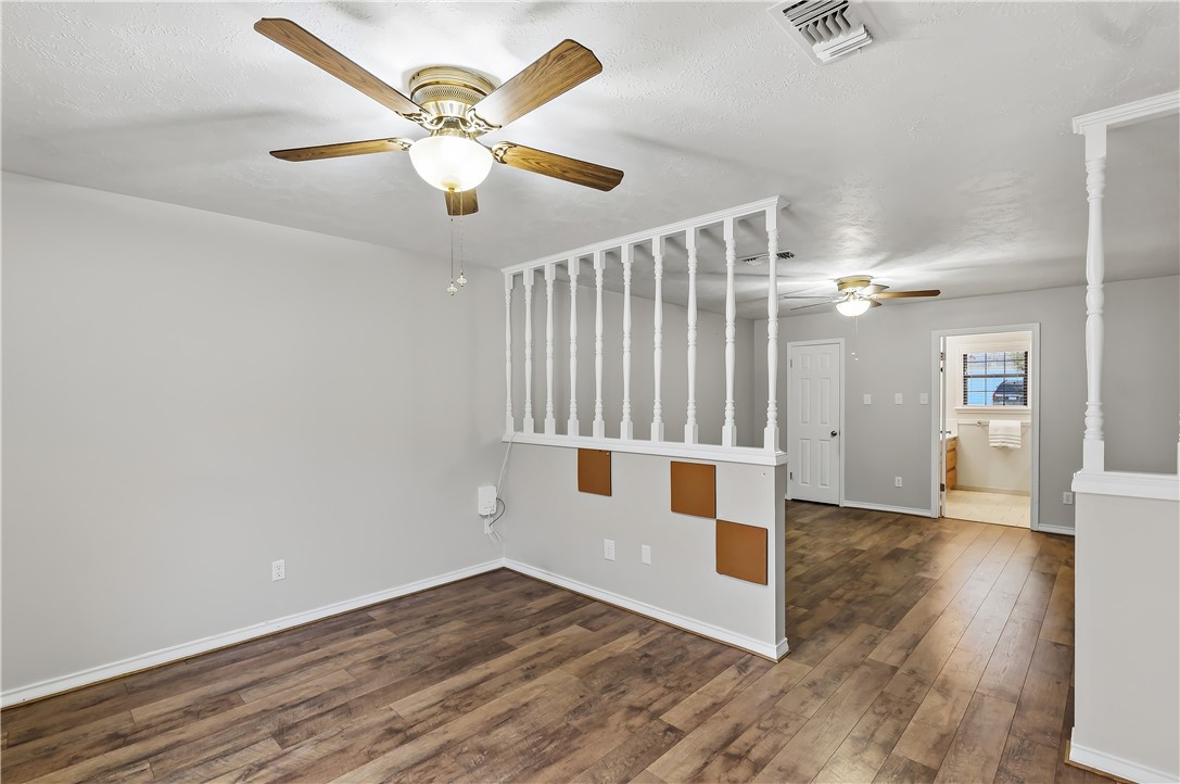904 Bob White Street Bryan, TX 77802 - Photo 20 of 36 wooden floor in an empty room with a window