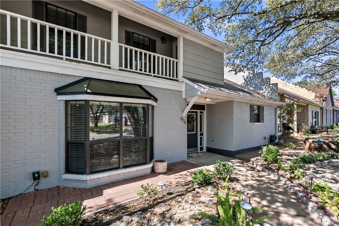 904 Bob White Street Bryan, TX 77802 - Photo 2 of 36 a front view of a house with a garden
