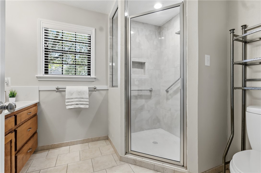 904 Bob White Street Bryan, TX 77802 - Photo 21 of 36 a bathroom with a bathtub and a shower