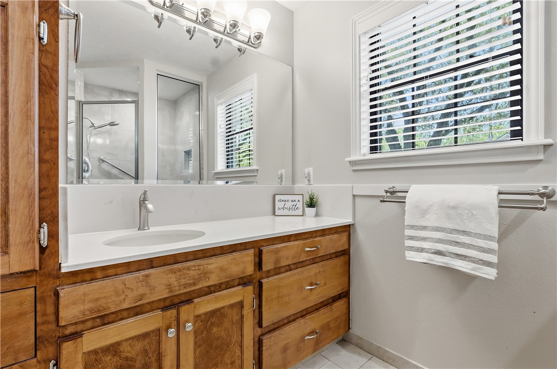 904 Bob White Street Bryan, TX 77802 - Photo 22 of 36 a bathroom with a sink and a window