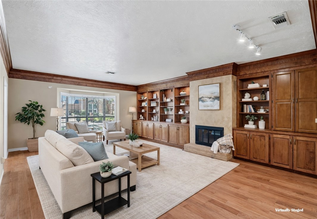 904 Bob White Street Bryan, TX 77802 - Photo 4 of 36 a living room with furniture and a fireplace