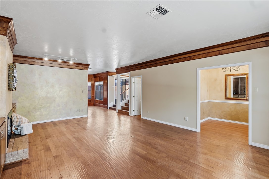 904 Bob White Street Bryan, TX 77802 - Photo 7 of 36 a view of empty room with wooden floor