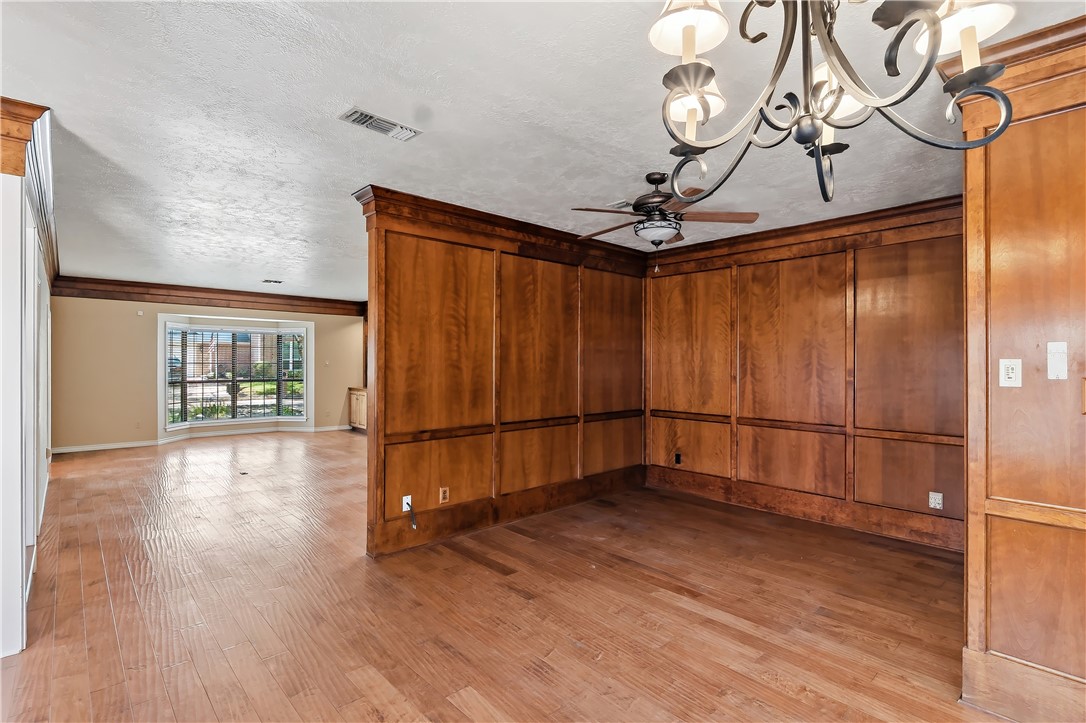 904 Bob White Street Bryan, TX 77802 - Photo 9 of 36 a view of a room with wooden floor and white walls