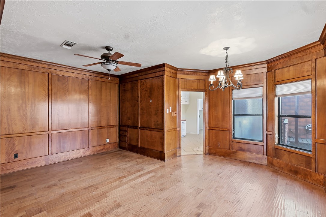 904 Bob White Street Bryan, TX 77802 - Photo 10 of 36 a very nice looking room with a chandelier fan and windows
