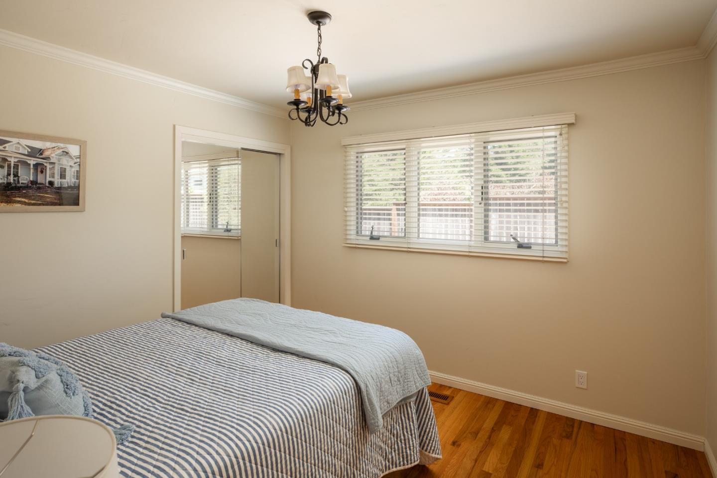 4117 Sunridge Road Pebble Beach, CA 93953 - Photo 18 of 46 a bedroom with a bed and a window