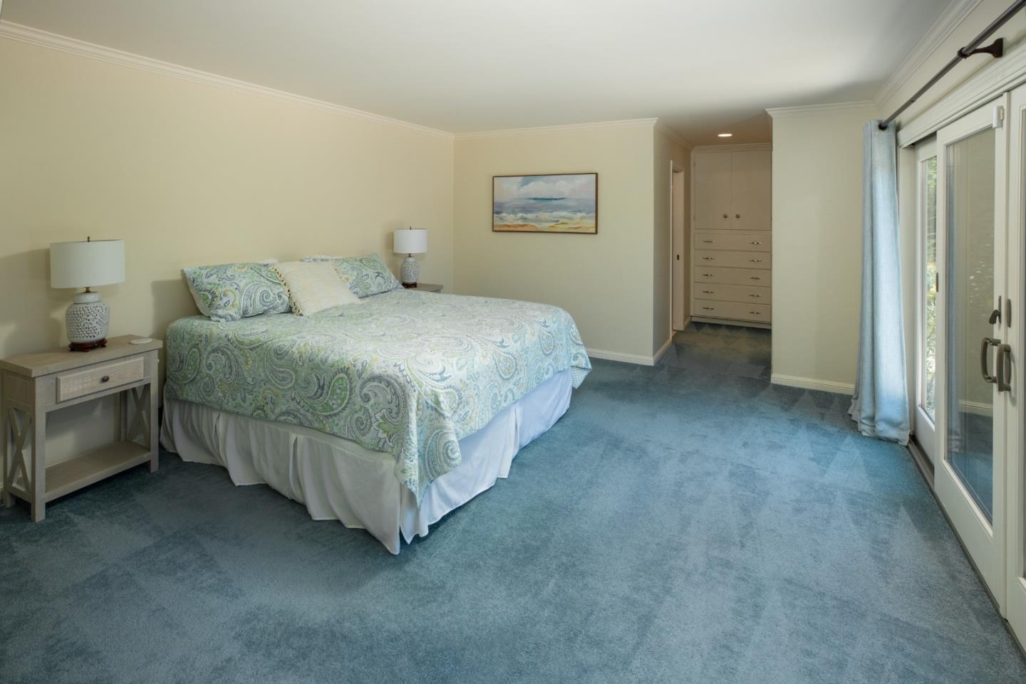 4117 Sunridge Road Pebble Beach, CA 93953 - Photo 20 of 46 a spacious bedroom with a bed and a cabinets