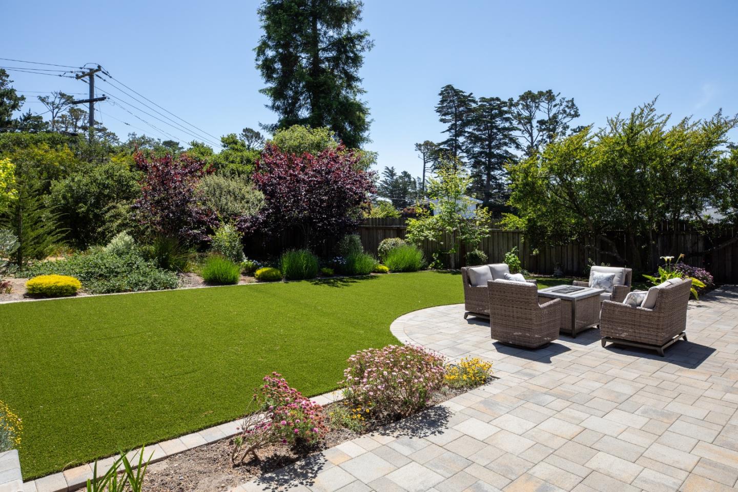 4117 Sunridge Road Pebble Beach, CA 93953 - Photo 25 of 46 a view of a table and chairs in the garden