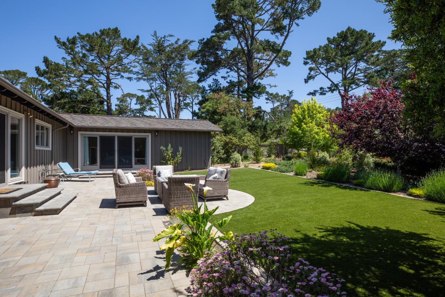 4117 Sunridge Road Pebble Beach, CA 93953 - Photo 26 of 46 a view of a house with backyard sitting area and garden