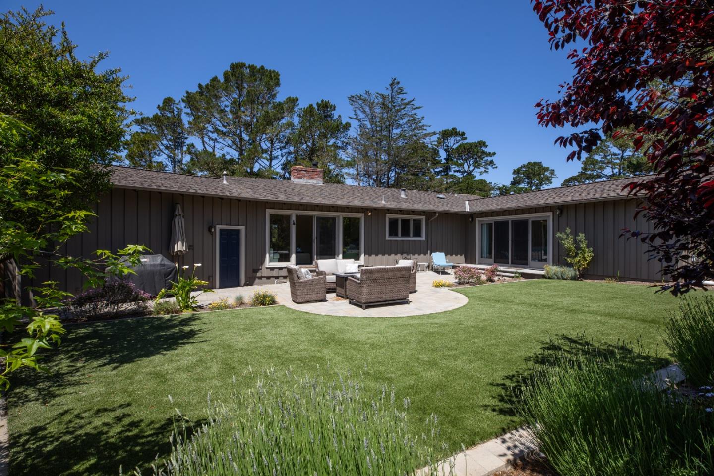4117 Sunridge Road Pebble Beach, CA 93953 - Photo 27 of 46 a view of a house with backyard and sitting area