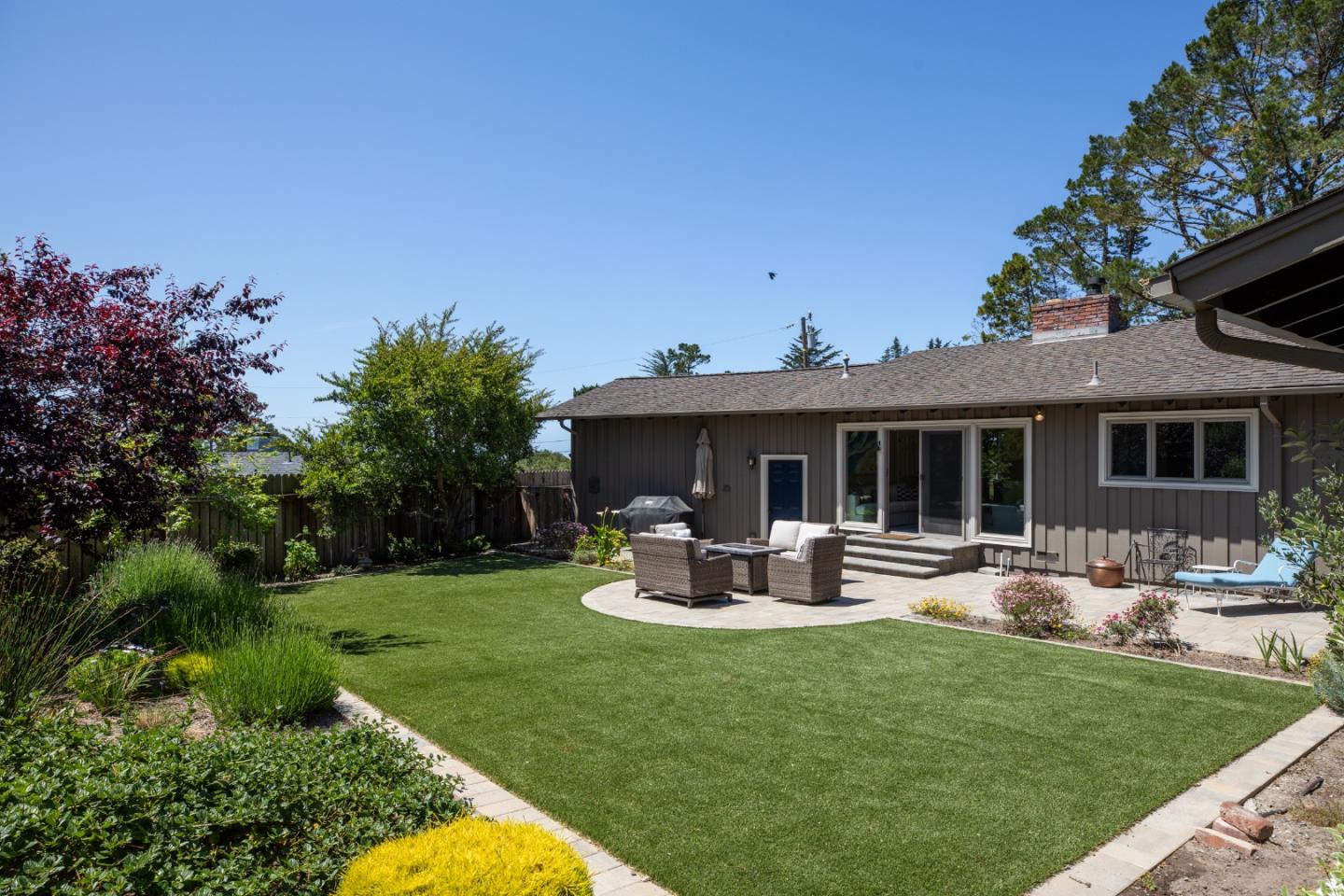 4117 Sunridge Road Pebble Beach, CA 93953 - Photo 29 of 46 a front view of house with a garden and patio
