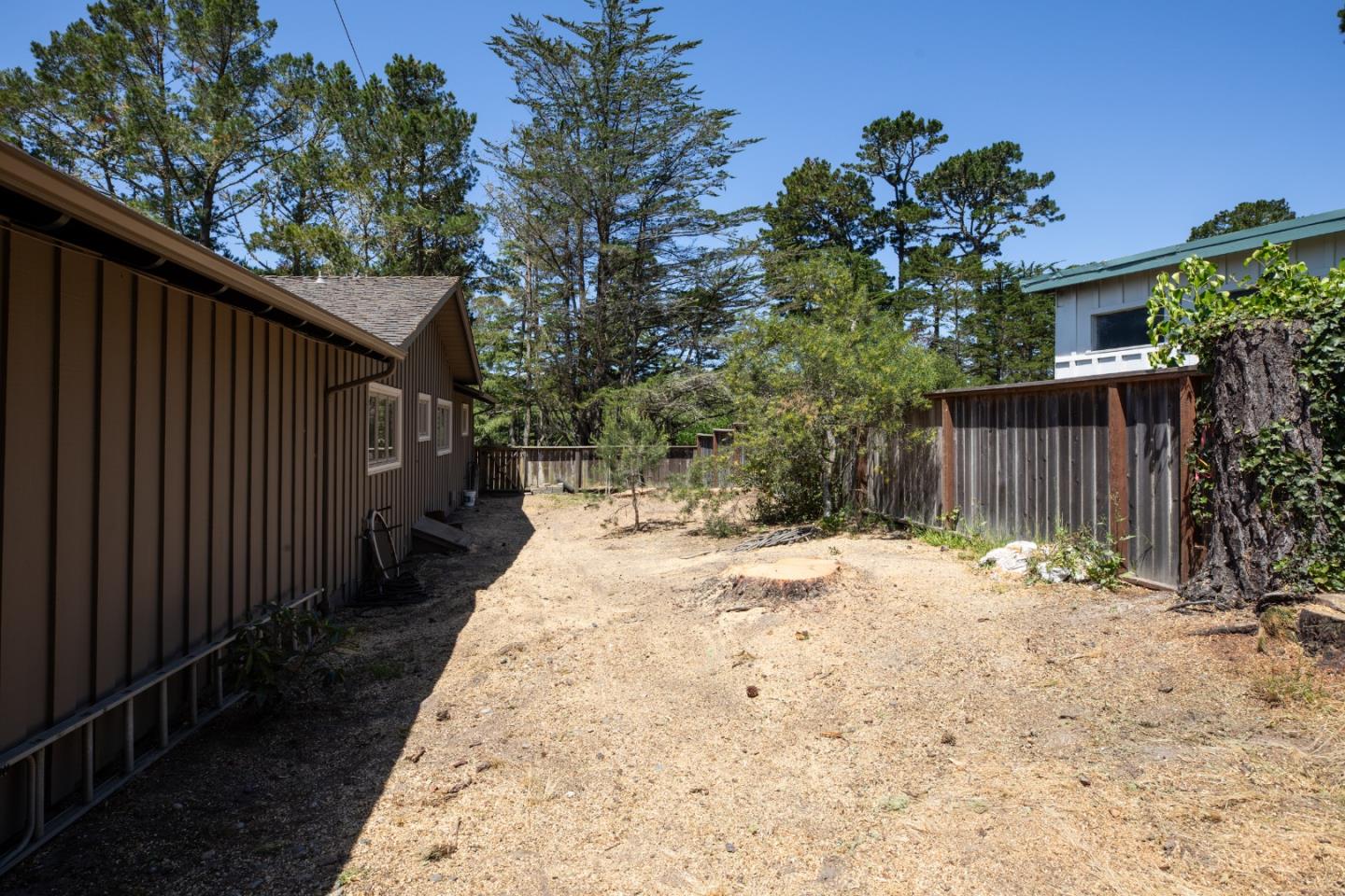 4117 Sunridge Road Pebble Beach, CA 93953 - Photo 31 of 46 a pathway of a house with wooden fence