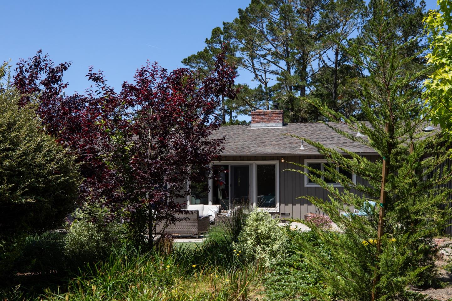 4117 Sunridge Road Pebble Beach, CA 93953 - Photo 36 of 46 a view of a house with patio and garden