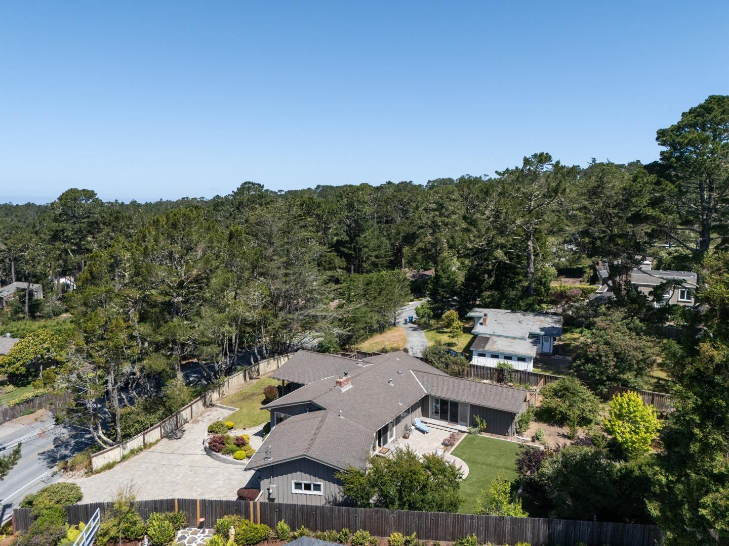 4117 Sunridge Road Pebble Beach, CA 93953 - Photo 40 of 46 an aerial view of a house with a garden